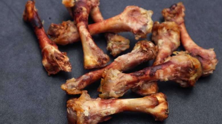 roasted chicken bones on gray background