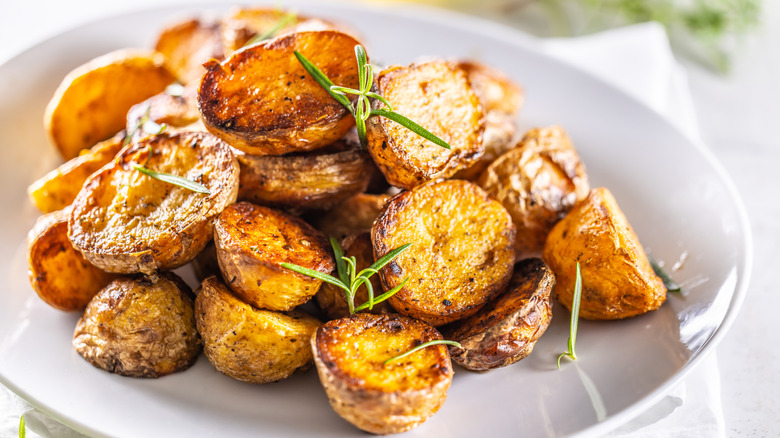 Prepping potatoes on a cutting board