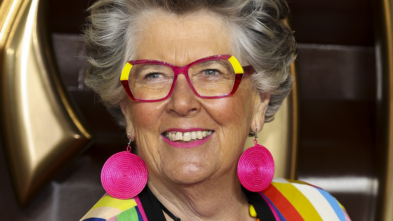 Close up of Prue Leith with bright pink earrings