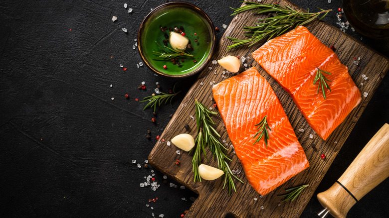 raw salmon on cutting board