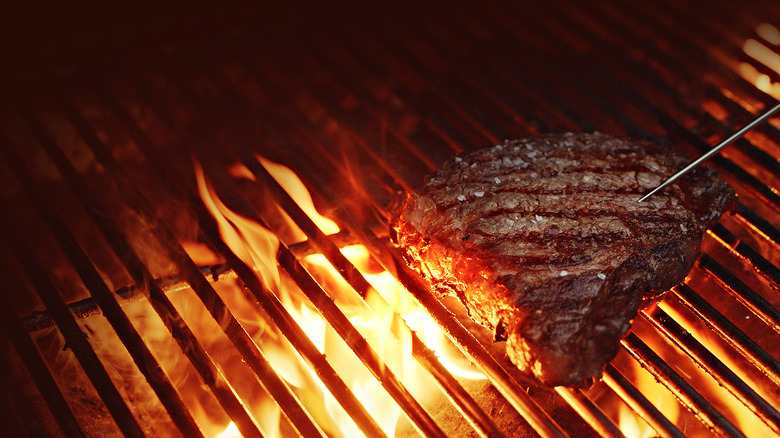 steak on flaming grill