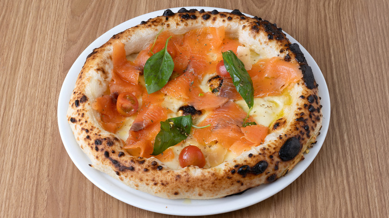 Smoked salmon pizza with basil