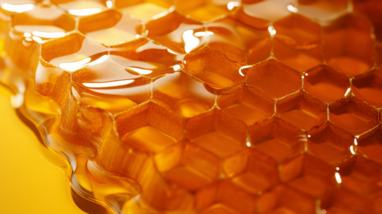 Fresh honey in hexagonal honeycombs