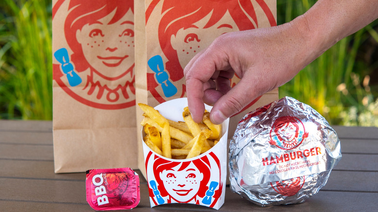 Person reaching for Wendy's french fries