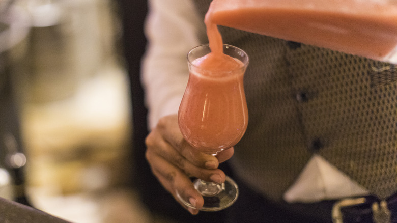 bartender pouring frozen drink