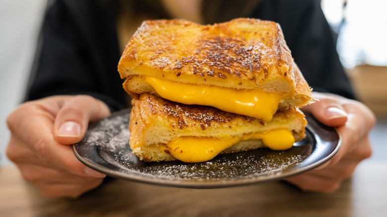 Grilled cheese on a brown plate