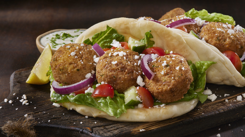 Falafel pita sandwich with lettuce, tomato and cucumber