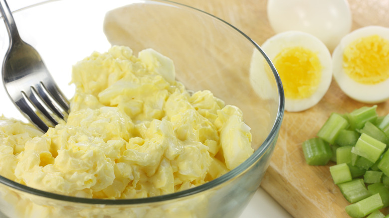 Mixing egg salad ingredients