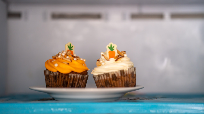 Two carrot cupcakes on plate