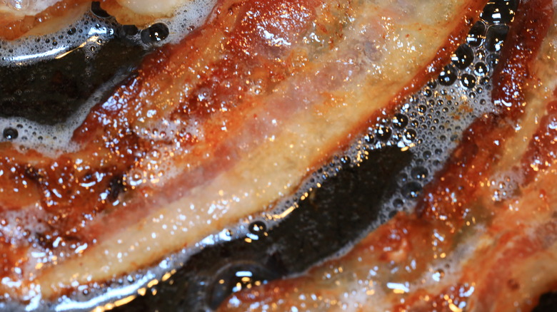 Bacon crisping in fat