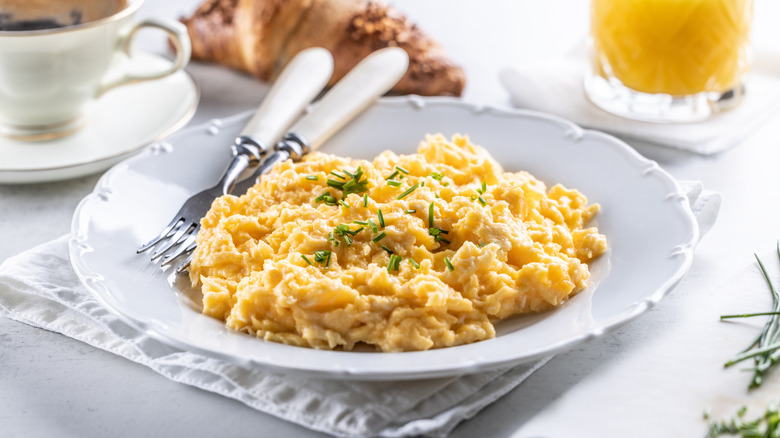 fluffy scrambled eggs with herbs