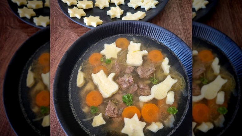 German wedding soup with eierstich shaped like cats and Stars of David