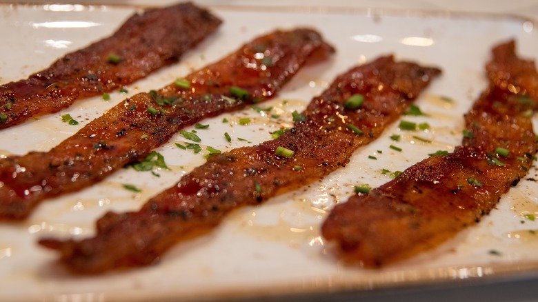 Candied bacon on white plate