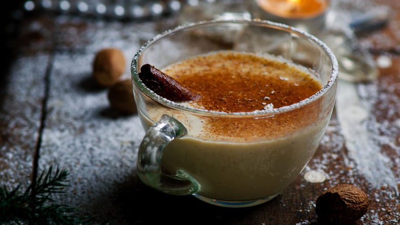 Eggnog with cinnamon and vanilla in a glass cup