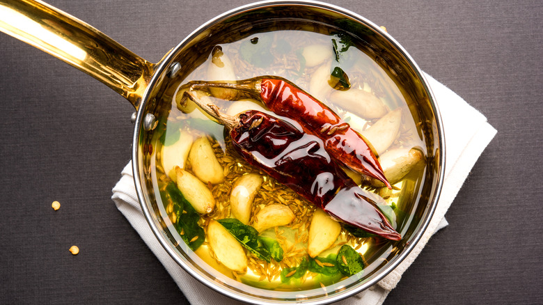 Tempering spices in a pot