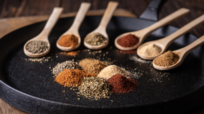 Spices on wooden spoons