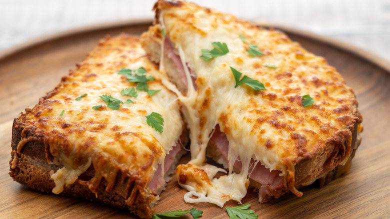 Croque monsieur on wooden plate