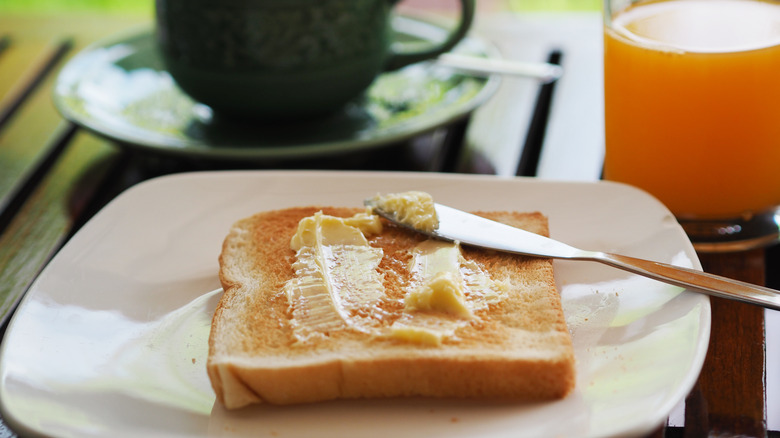 Buttered toast with coffee and juice