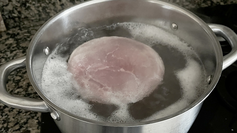 Ham boiling on stove