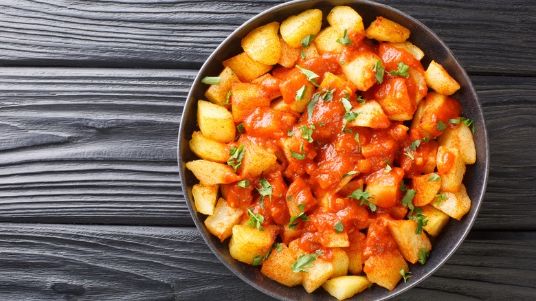 Closeup of a bowl of patatas bravas