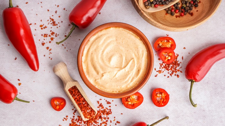 bowl of spicy mayo and peppers