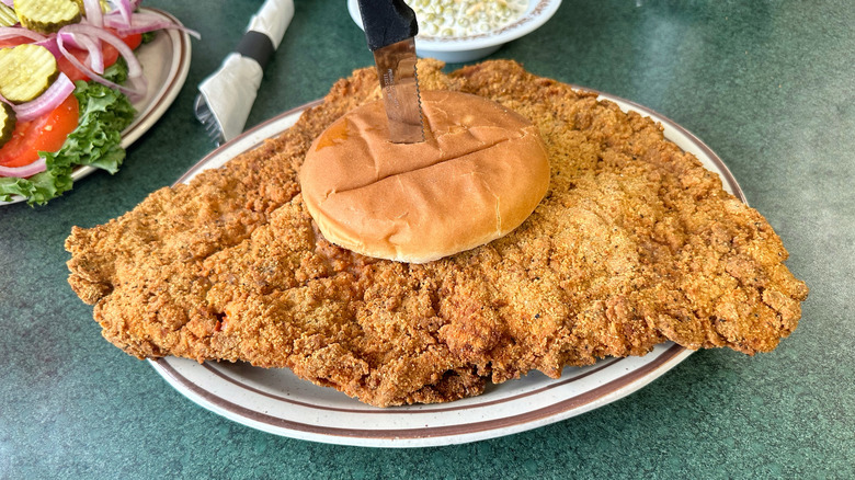 Pork tenderloin sandwich on a plate