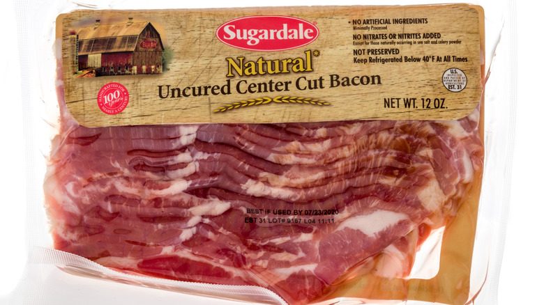 A package of Sugardale uncured bacon on a plain background