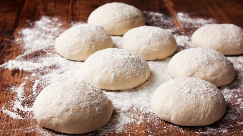 Pizza dough balls dusted with flour