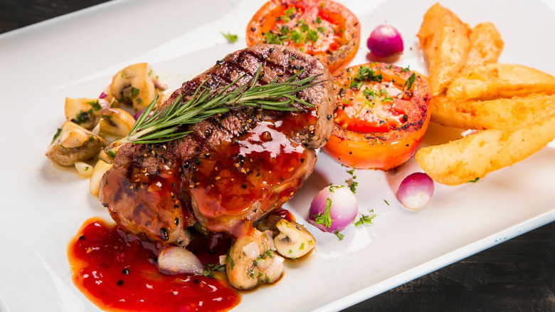 A steak served with sauce