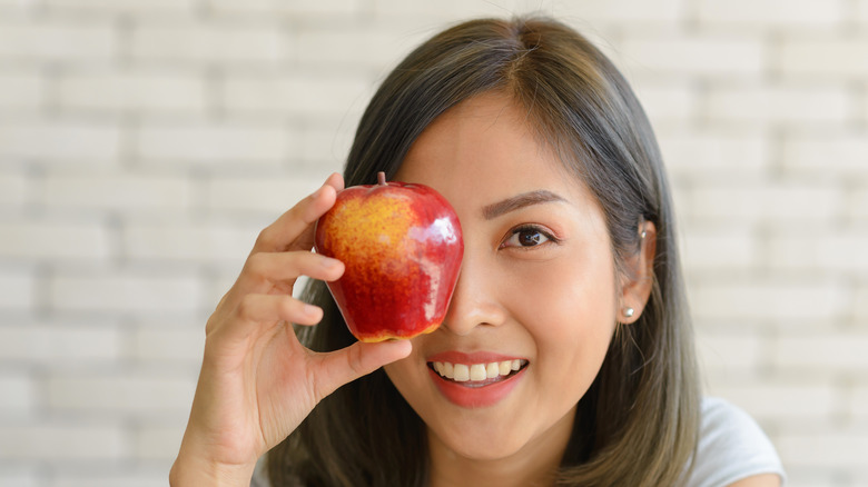 Apple in front of eye