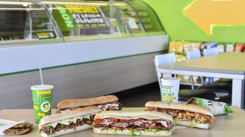 Subway sandwiches, drinks, and cookie