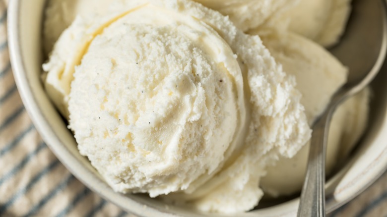 Scoops of vanilla ice cream with vanilla bean flecks