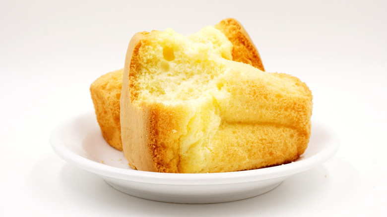 Chinese paper-wrapped sponge cakes on a white plate