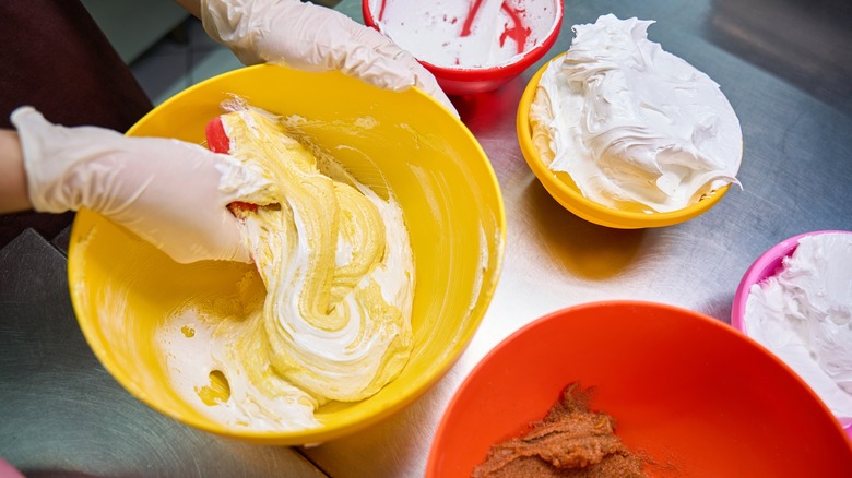 professional chef demonstrating macaronage