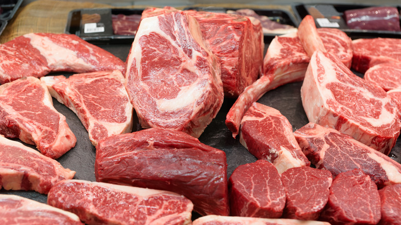 Various steaks on display at butcher shop