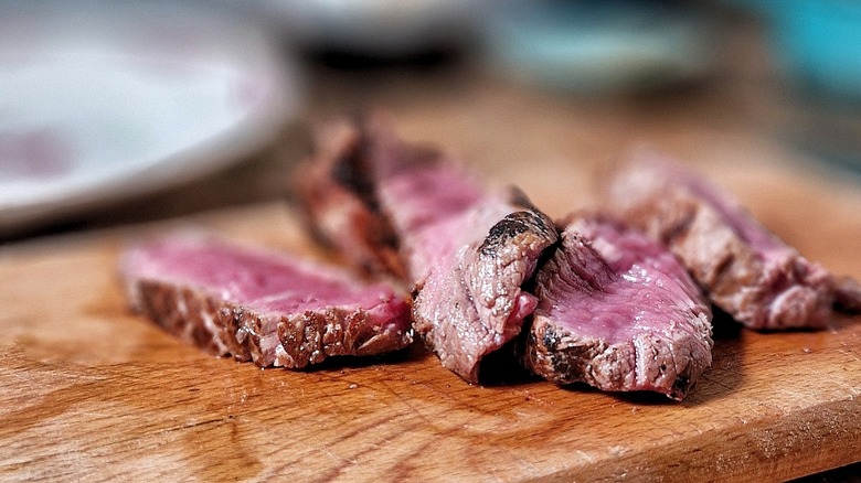 Seared flank steak on a cutting board