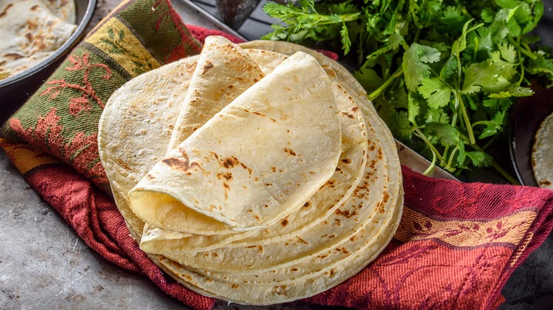 Corn tortillas piled on a towel