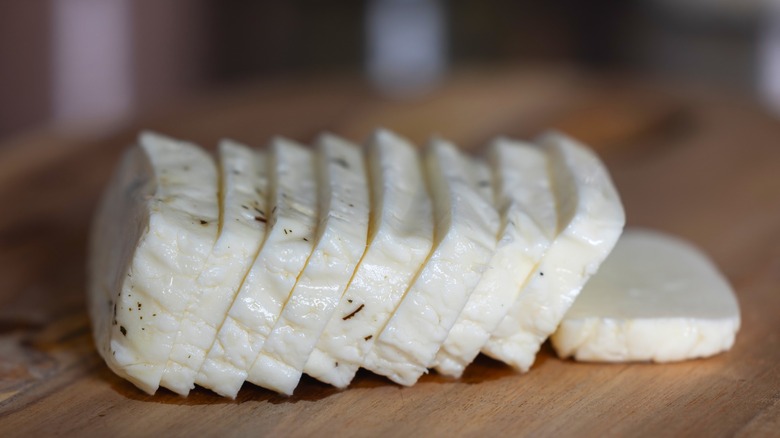 Sliced halloumi on cutting board