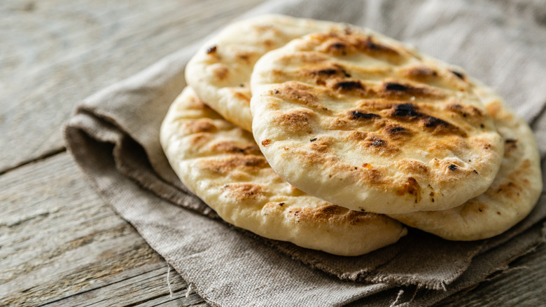 stack of naan on cloth