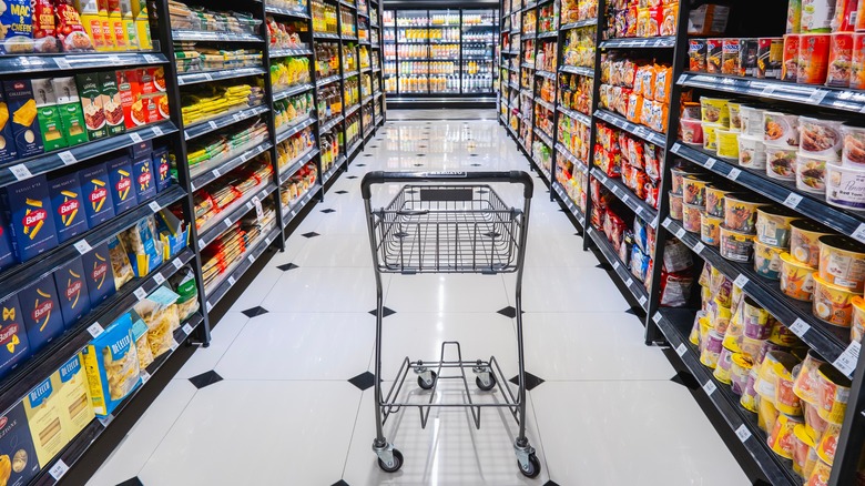 Shopping cart in grocery aisle