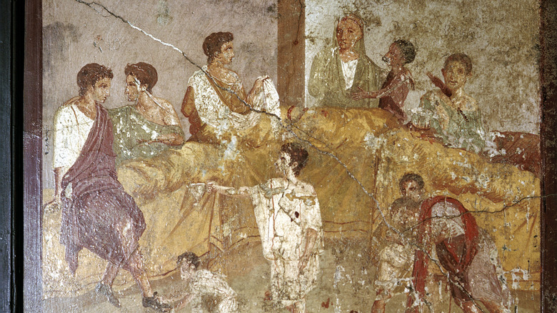 Ancient Roman art depicting a dinner party