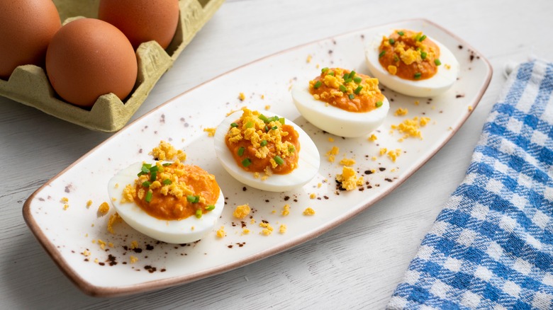 White serving platter of Spanish deviled egg tapas