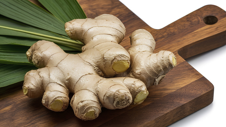 fresh ginger on a wooden cutting board