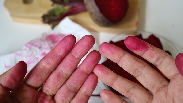 Beet juice stained hands