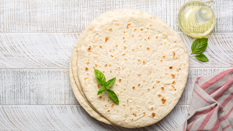 Piadina flatbread with olive oil and basil