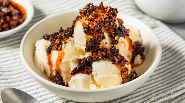 A bowl of ice cream topped with chili crisp
