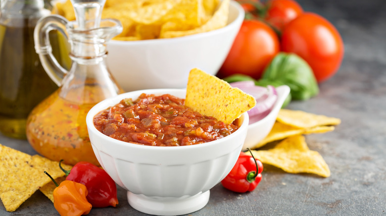 displayed salsa bowl with chips