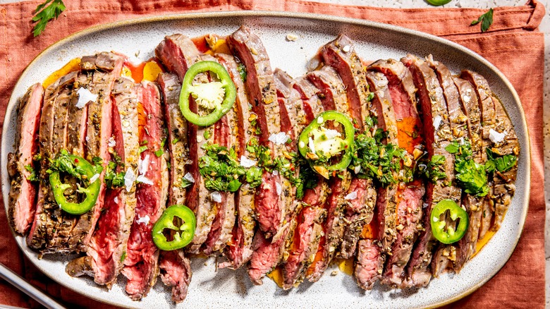 Marinated and grilled flank steak with herbs