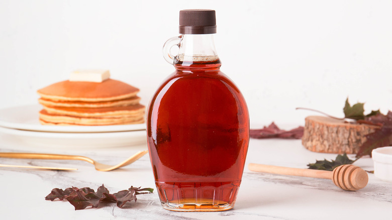 bottle of syrup with pancakes