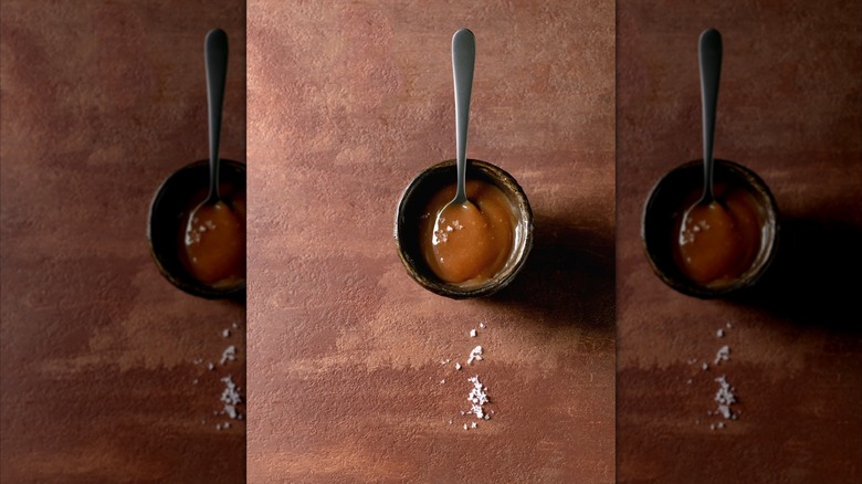 Caramel sauce with salt and spoon